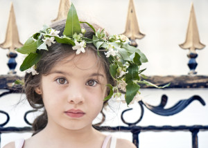Little girl with ivy flowers